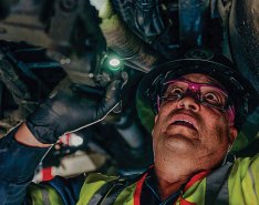 Fleetio image of man doing fleet maintenance