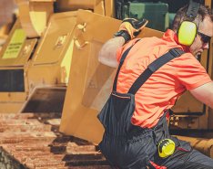 Man in PPE working on equipment