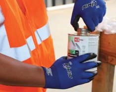 Worker wearing MCR Safety gloves