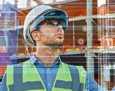 Image of man in construction gear with tech illustration overlaid 