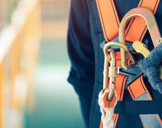 hand clipping safety harness in place