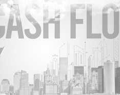 Man in hard hat standing in front of illustration of city with the words "cash flow" over it