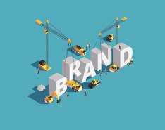 Illustration of construction equipment building the word "brand"