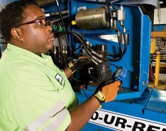 Man working on United Rentals machine