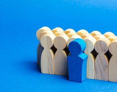 One figurine standing out from the others to illustrate how top talent is set apart 