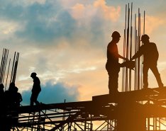 Construction workers on scaffolding