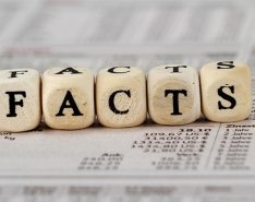 Dice spelling out "facts"