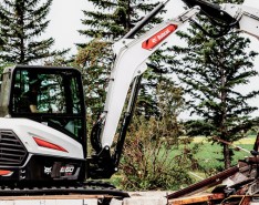 A bobcat excavator goes to work.
