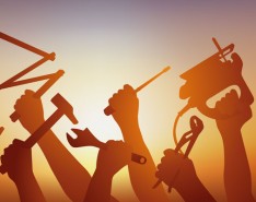 Ten hands holding various tools are silhouetted against a yellow and orange gradient background