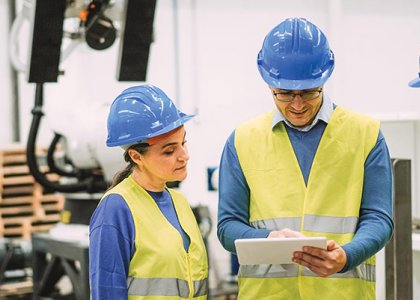 Three construction workers representing multigenerational team