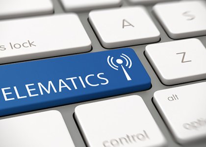 Computer keyboard with a "telematics" button