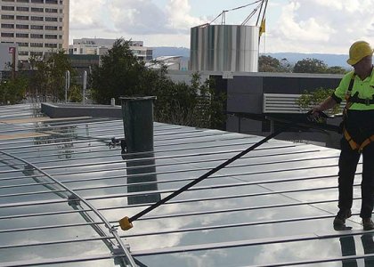 Construction worker in fall protection gear courtesy of Diversified Fall Protection