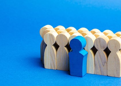 One figurine standing out from the others to illustrate how top talent is set apart 