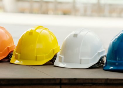 row of construction safety helmets