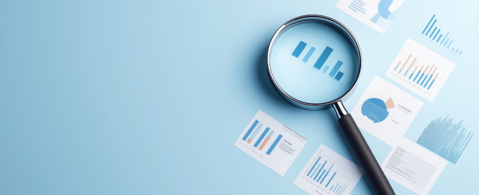 magnifying glass over financial report
