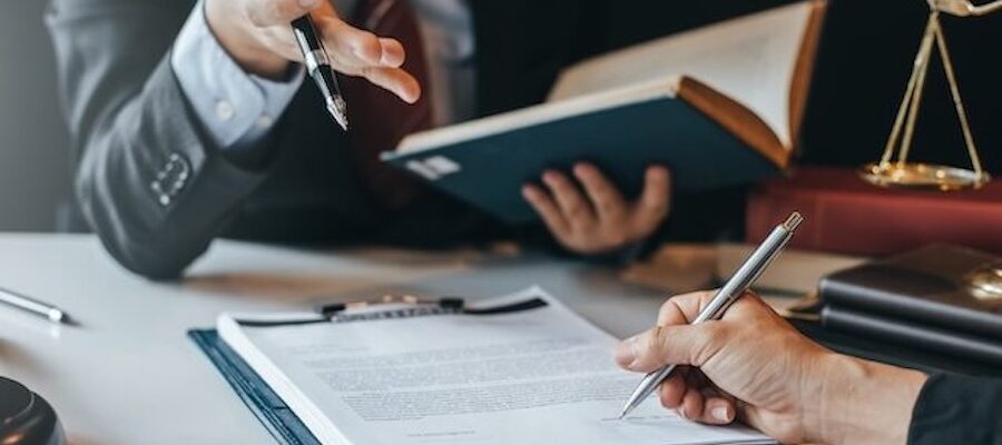 Lawyers reviewing and signing legal documents