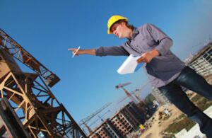 Construction manager reviewing plans at jobsite