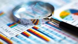 magnifying glass over financial report