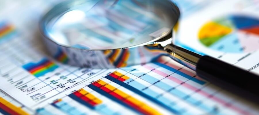 magnifying glass over financial report