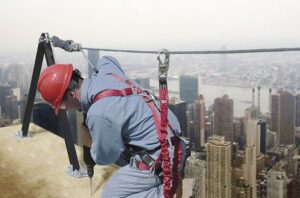 Construction worker using a rooftop safety harness