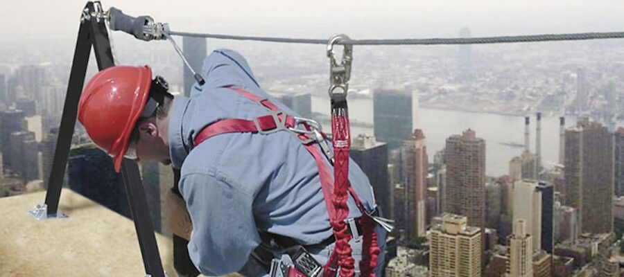 Construction worker using a rooftop safety harness