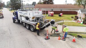 construction workers pouring volumetric concrete