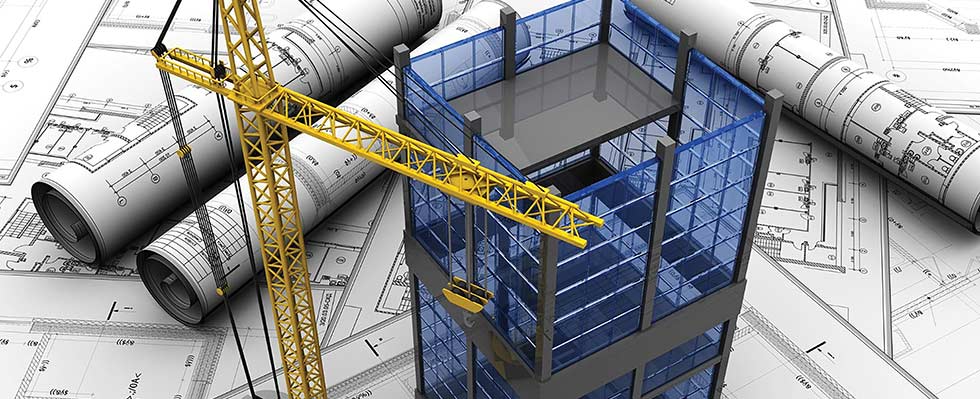 Toy building and crane on blueprints