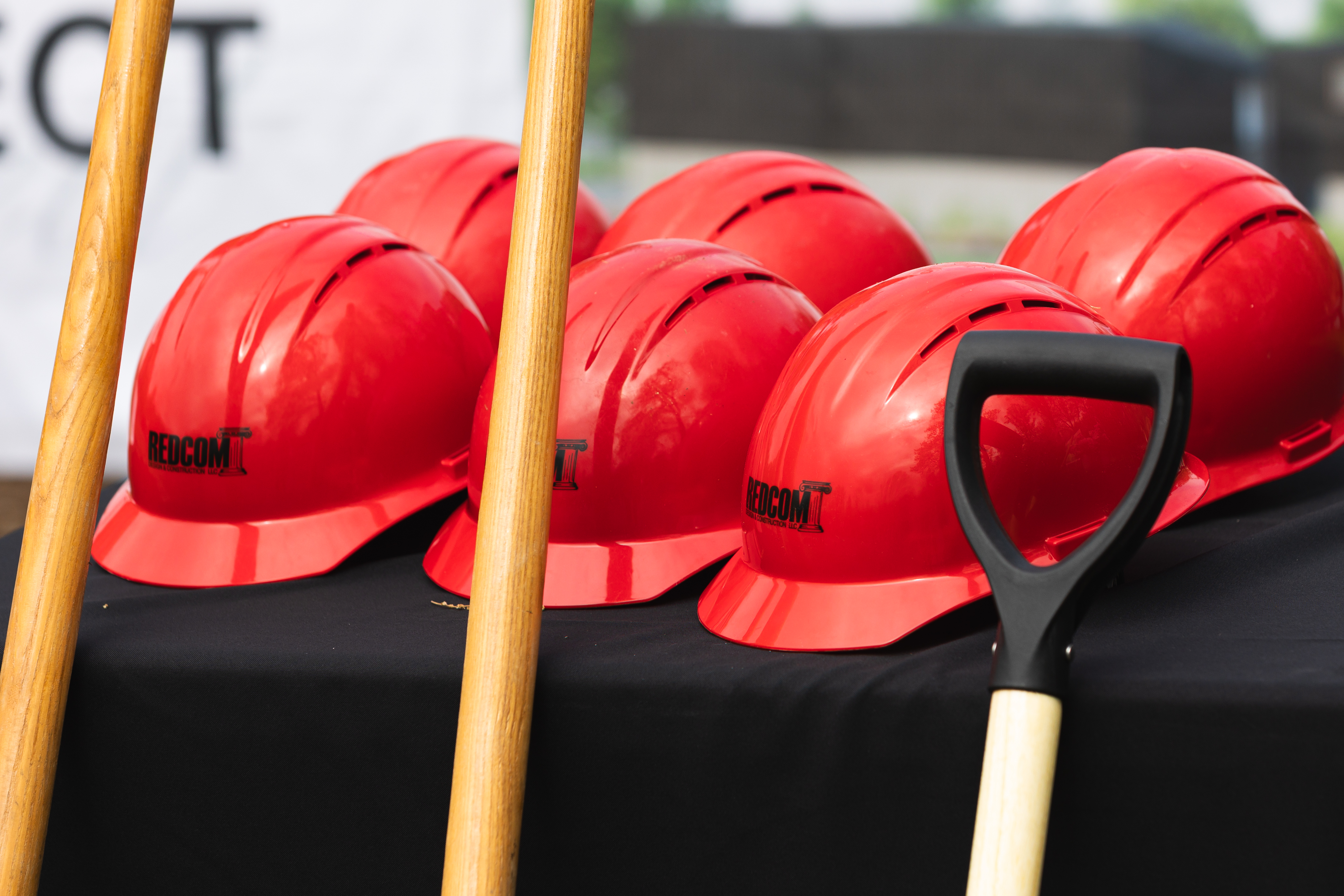 REDCOM hard hats at a groundbreaking