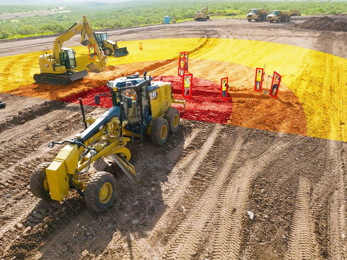 Caterpillar machines on jobsite with jobsite technology highlighting workers 