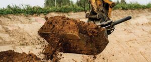 Excavator bucket full of dirt