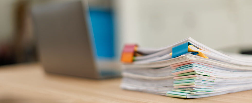 Stack of paperwork on a desk