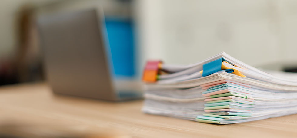 Stack of paperwork on a desk