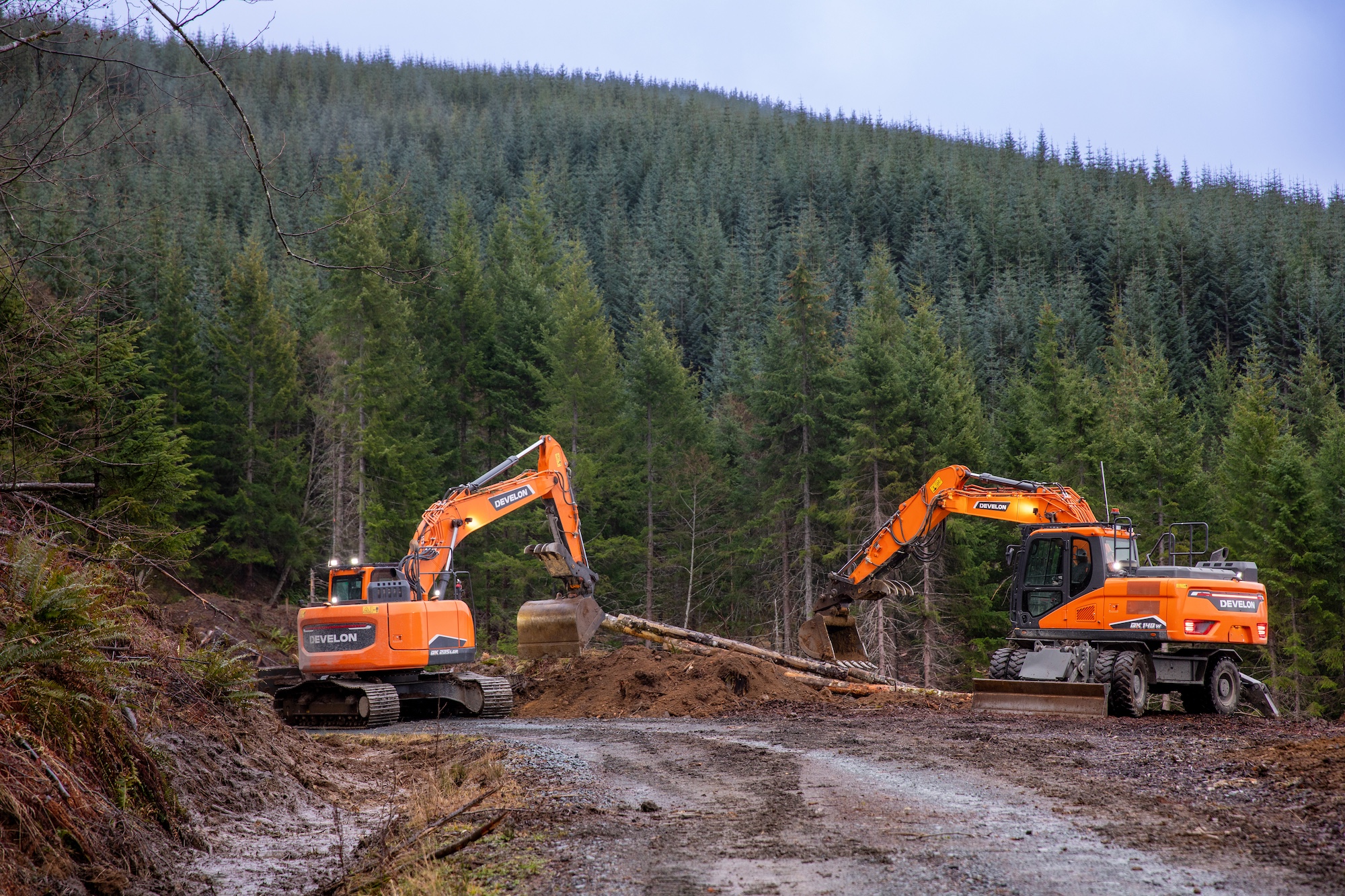 Two Develon machines in forest