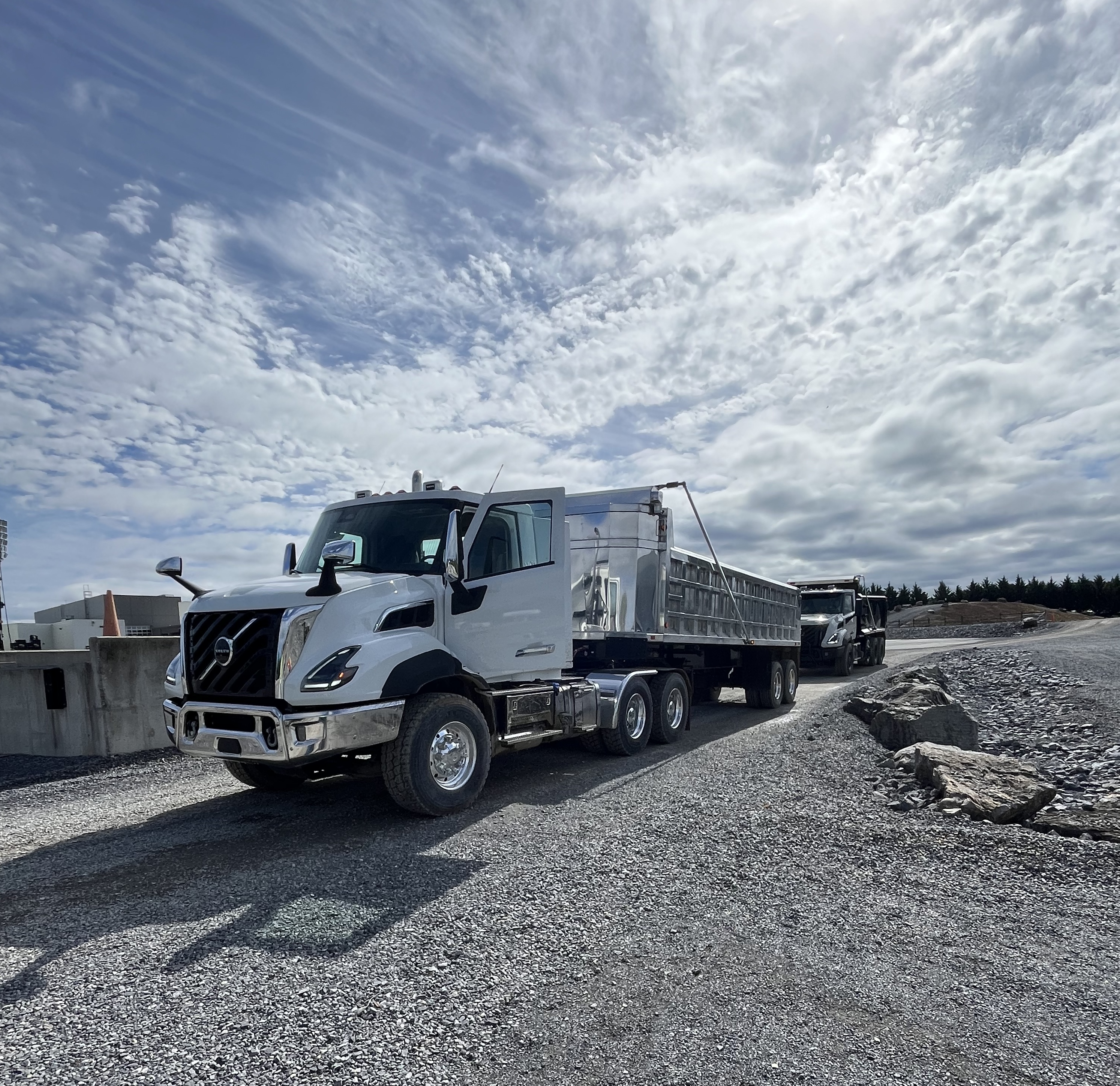Volvo VNX vocational truck in a gravel lot 