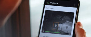 Smartphone with jobsite camera feed on the screen