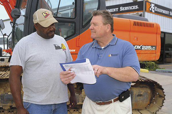 Equipment dealer and customer discussing options