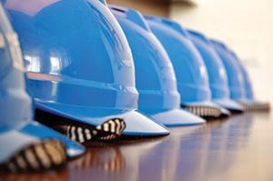 blue hardhats in a row
