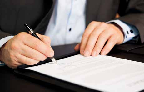 business man signing papers