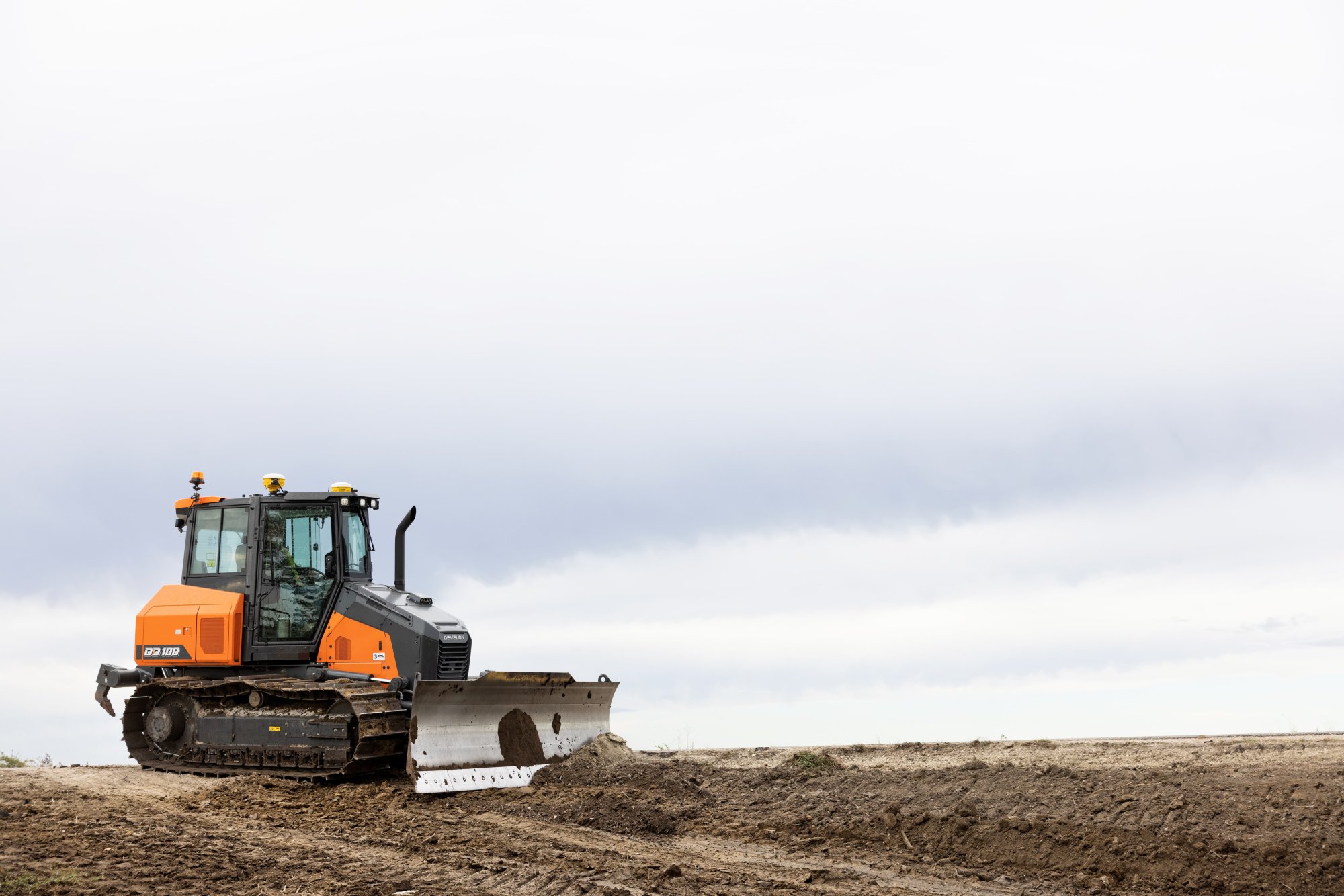 Bulldozer grading construction site terrain