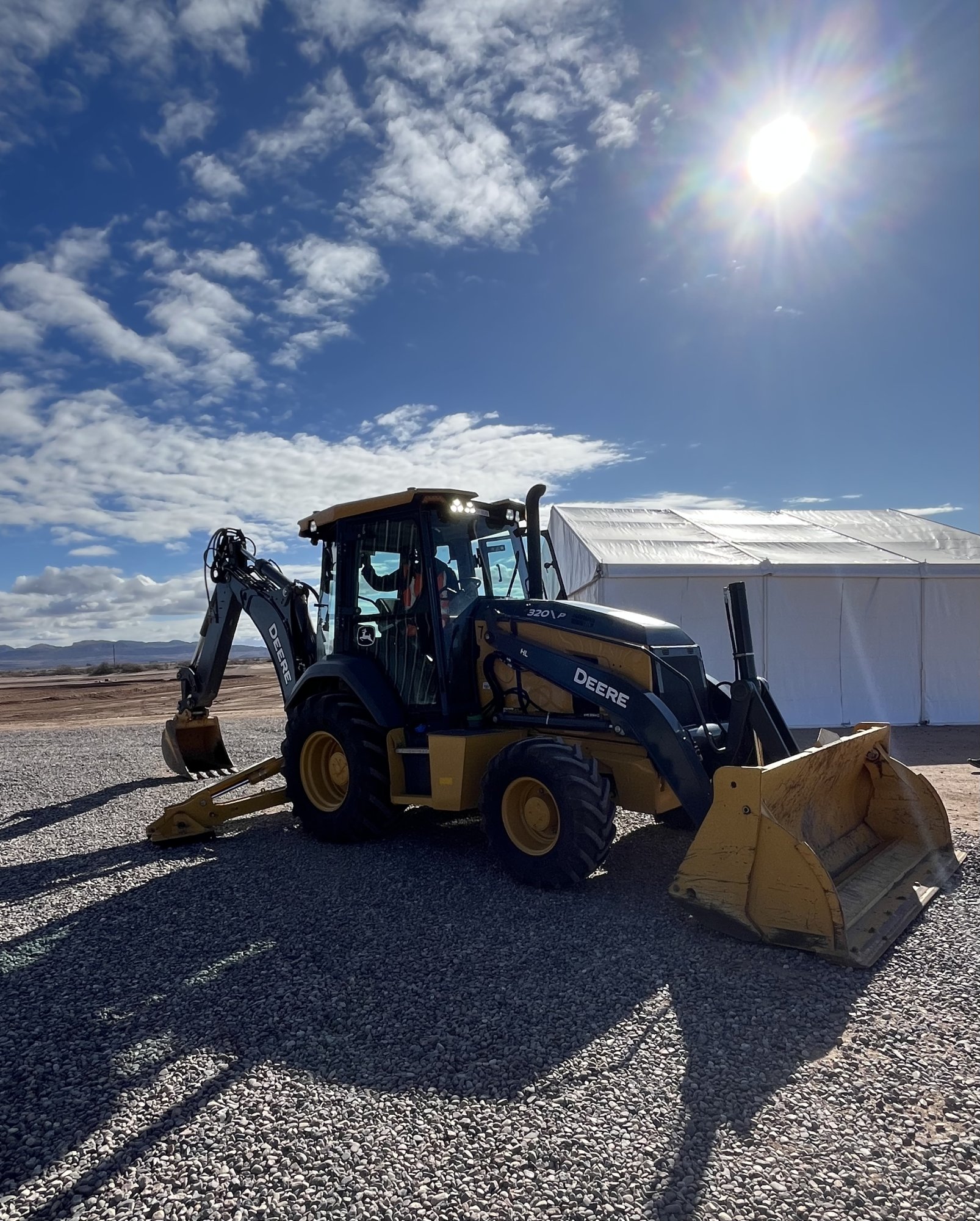 John Deere 320 P-tier backhoe