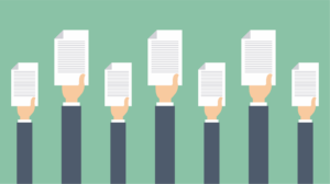 hands holding contracts in the air