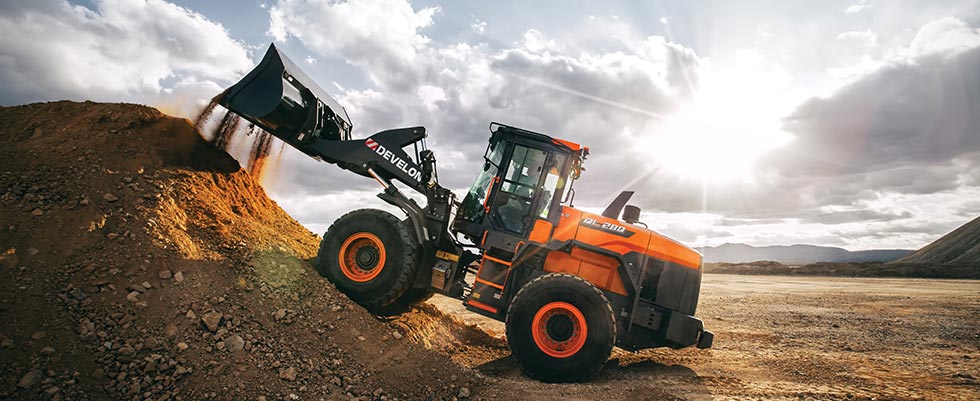 Wheel loader transporting aggregate material