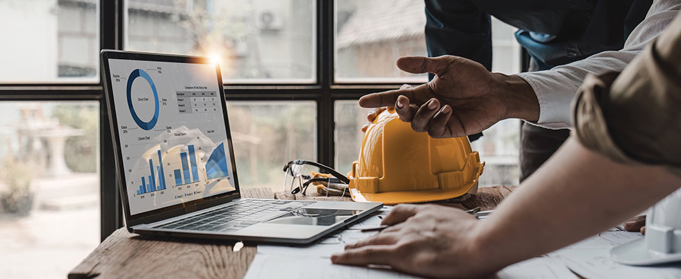 Construction professionals reviewing project data