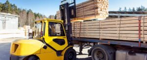 lumber being loaded for hauling