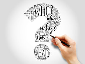 Hand drawing a question mark with words