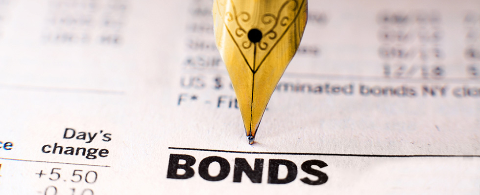 quill pen writing on a bond contract