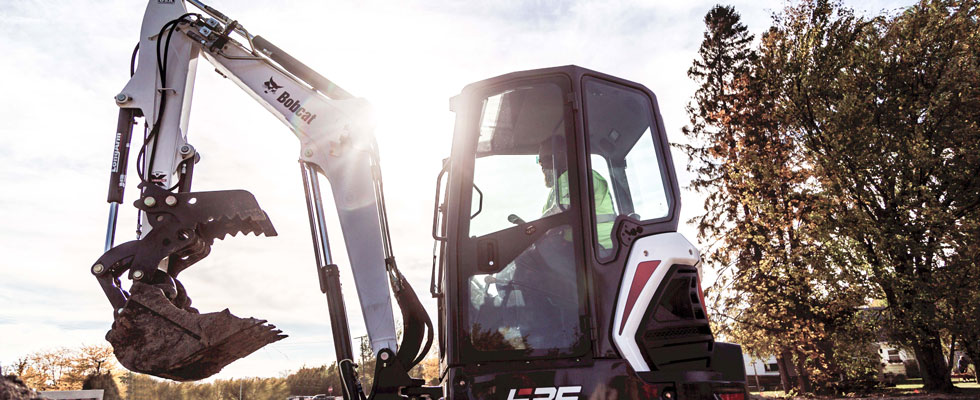 Compact excavator cab at construction site
