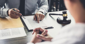 two people reviewing a legally binding contract