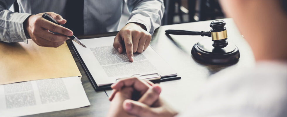 two people reviewing a legally binding contract