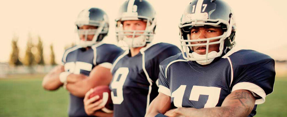 three football players in uniform